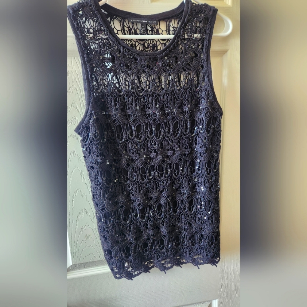 Classy black tank top with sequin accents.